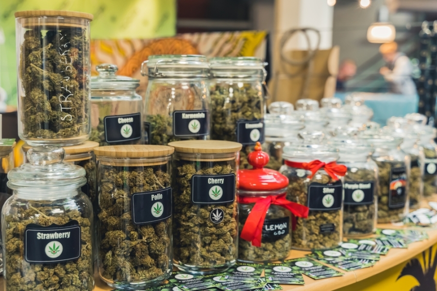Jars of cannabis for sale in a dispensary.
